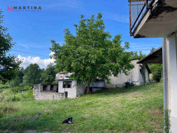 Semi-detached house with land
