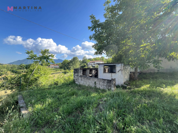 Semi-detached house with land