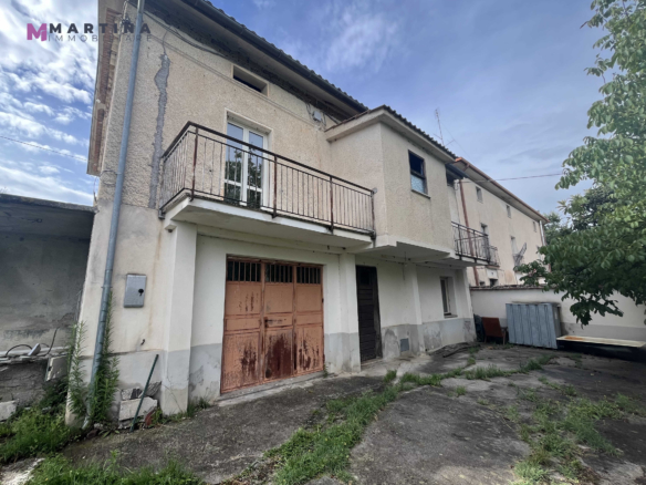 Semi-detached house with land