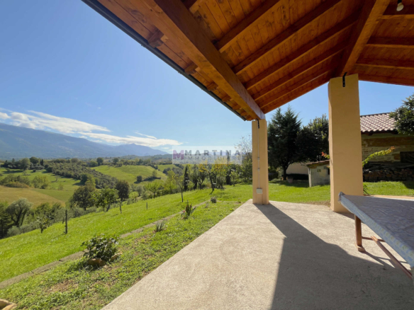 Farmhouse surrounded by nature with land