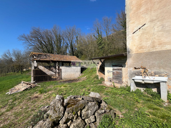 Portion of an old farmhouse with land