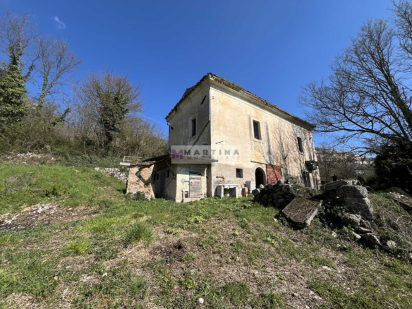 Portion of an old farmhouse with land