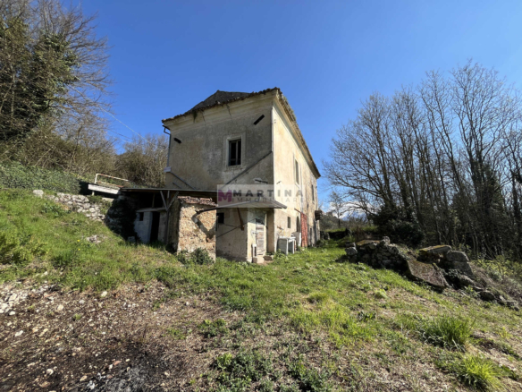 Portion of an old farmhouse with land