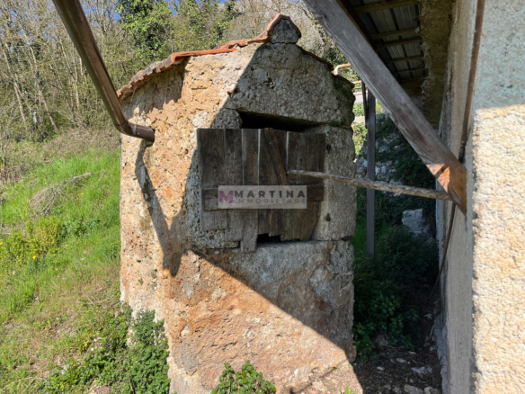 Portion of an old farmhouse with land
