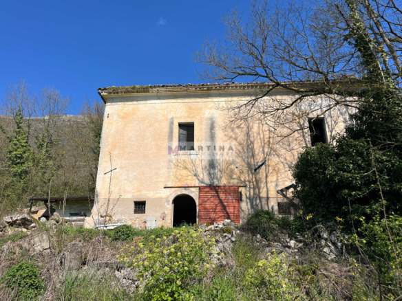 Portion of an old farmhouse with land