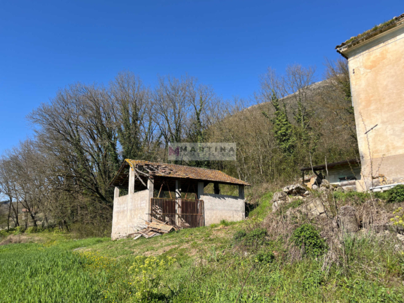 Portion of an old farmhouse with land