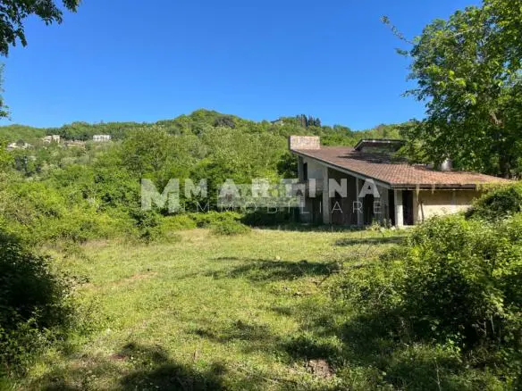 Property with reinforced concrete structure, buildings and land