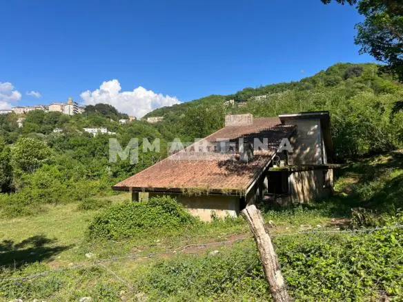 Property with reinforced concrete structure, buildings and land