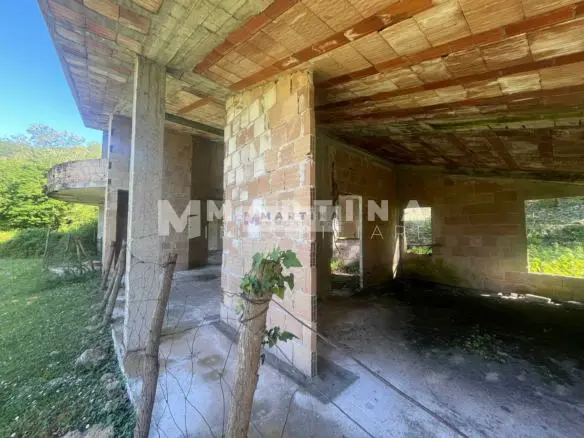 Property with reinforced concrete structure, buildings and land