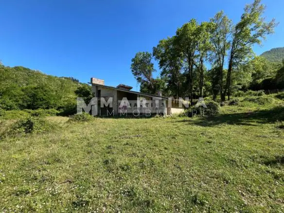 Property with reinforced concrete structure, buildings and land