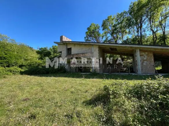 Property with reinforced concrete structure, buildings and land