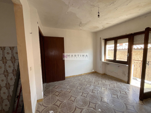 Terraced house with 3 apartments, terrace and garage