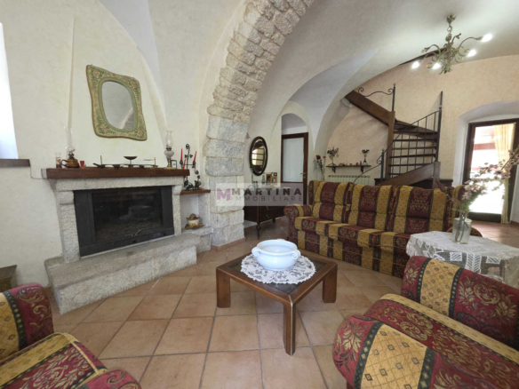 Portion of a three-storey farmhouse with garden