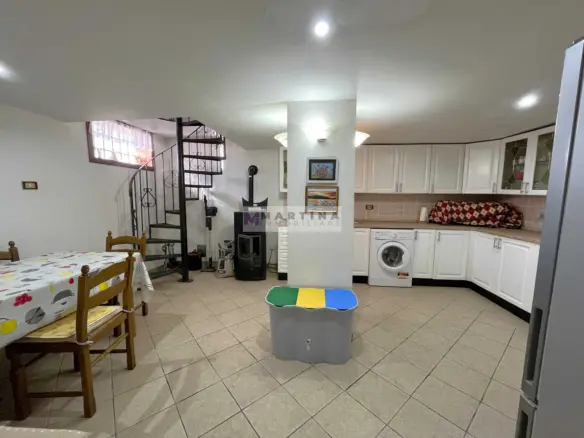 Detached house with garage and land