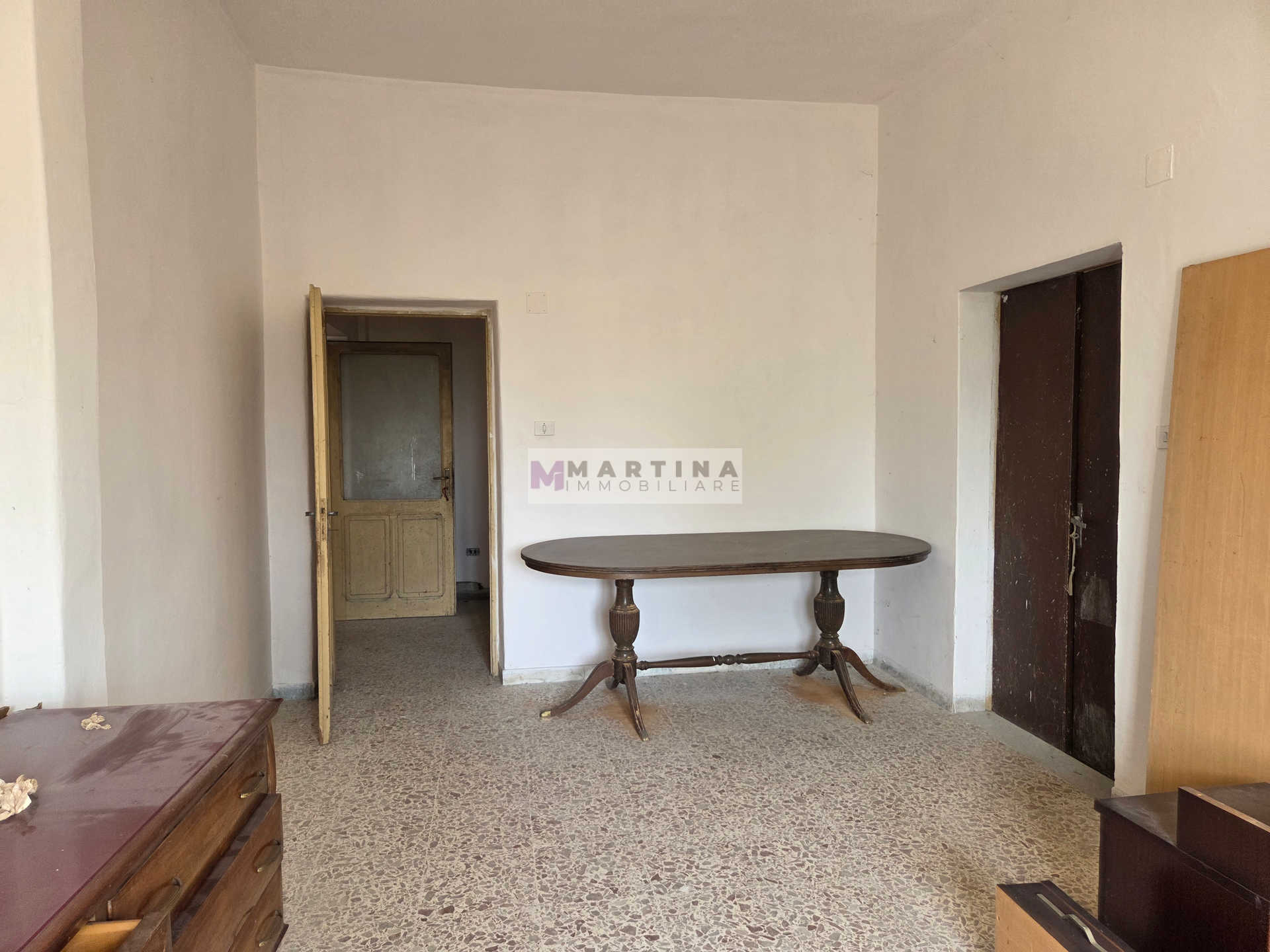 Portion of a farmhouse with olive grove